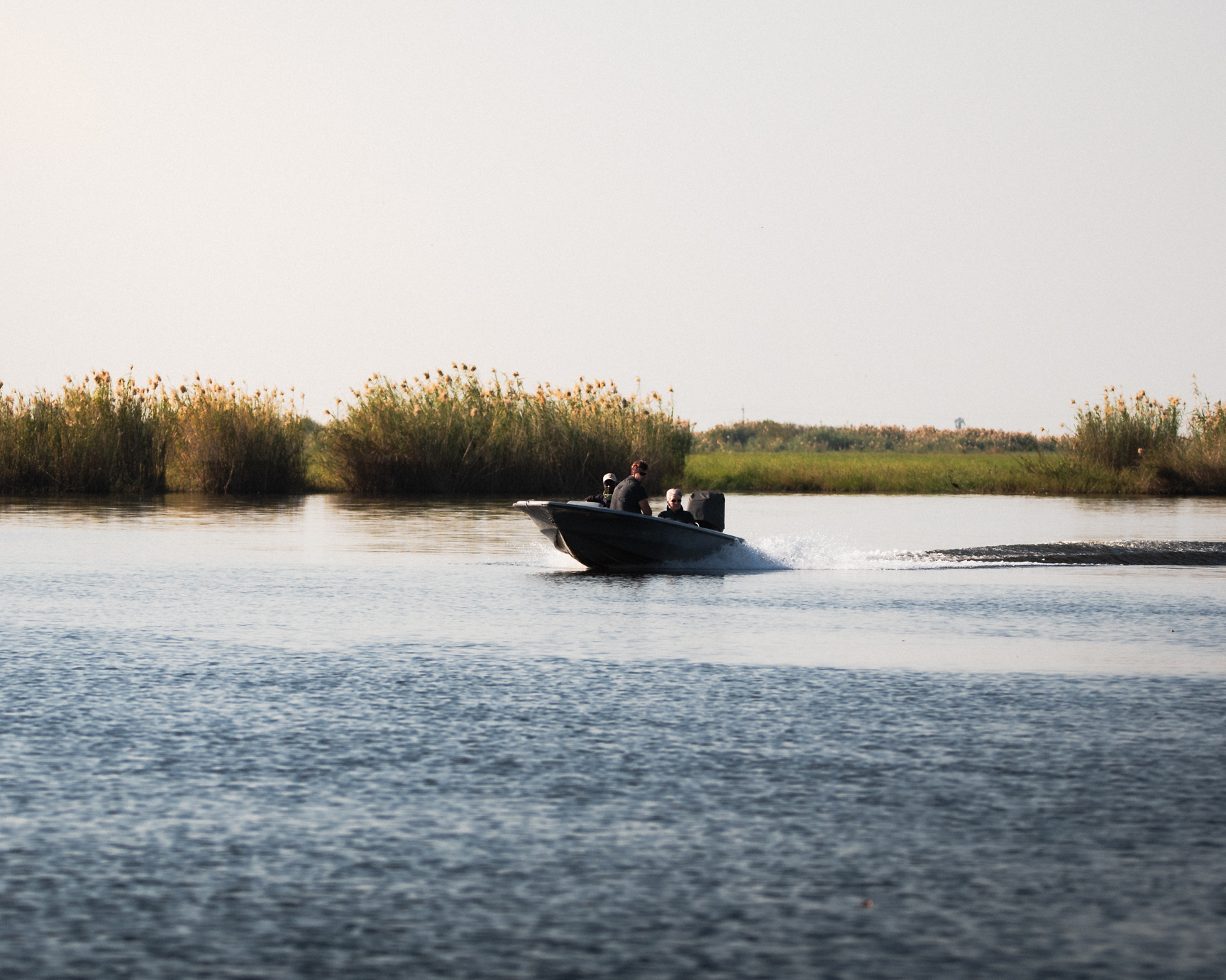 A boat passes by during our water safari in Chobe National Park