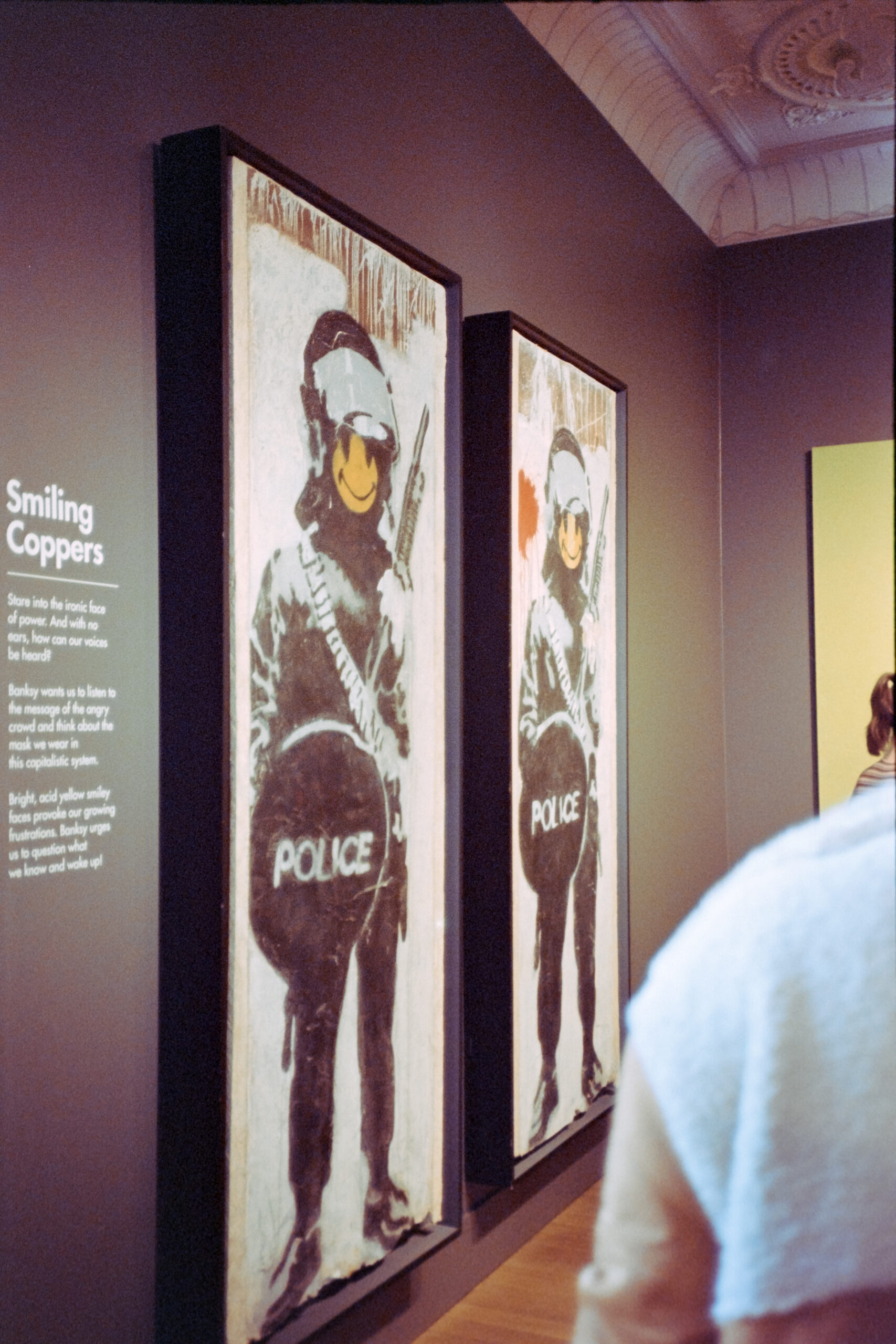 A photo of Banksy's "Smiling Coppers" at the MOCO Museum in Amsterdam.